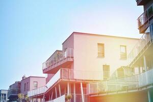 Residential Building on sky background. Facade of a modern housing construction with of balconies. photo