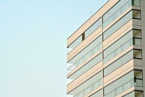 Residential Building on sky background. Facade of a modern housing construction with of balconies. photo