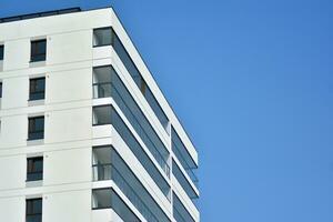 Residential Building on sky background. Facade of a modern housing construction with of balconies. photo