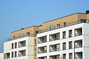 Residential Building on sky background. Facade of a modern housing construction with of balconies. photo