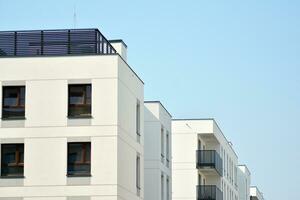 Residential Building on sky background. Facade of a modern housing construction with of balconies. photo