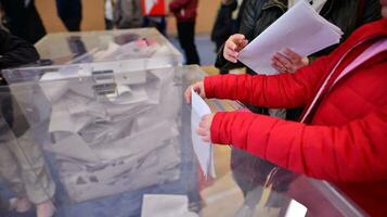 Warsaw, Poland 15 October 2023. Parliamentary elections in Poland. The process of voting at a polling station. photo