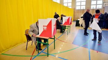 Warsaw, Poland 15 October 2023. Parliamentary elections in Poland. The process of voting at a polling station. photo