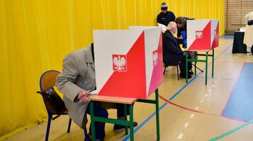 Warsaw, Poland 15 October 2023. Parliamentary elections in Poland. The process of voting at a polling station. photo