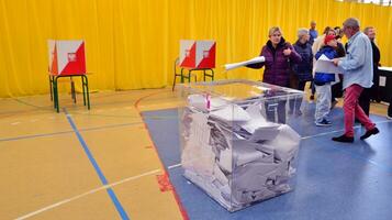 Warsaw, Poland 15 October 2023. Parliamentary elections in Poland. The process of voting at a polling station. photo