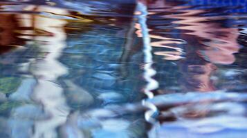 Blue swimming pool part detail in summer day vacation. Crystal blue swimming pool water. photo