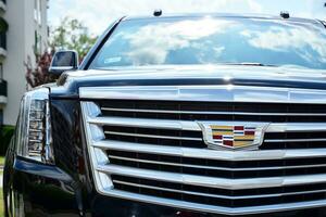 Warsaw, Poland. 22 July 2019. Motor car Cadillac Escalade at the city street. Cadillac Escalade SUV commands attention with its superior craftsmanship and iconic design. photo