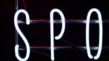 Glowing fragment of a neon sign, close-up, abstract background photo