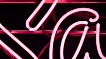 Glowing fragment of a neon sign, close-up, abstract background photo