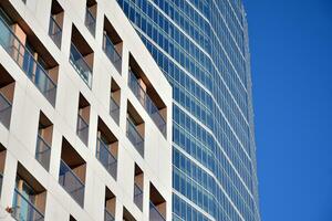 Modern apartment buildings on a sunny day with a blue sky. Facade of a modern apartment building photo