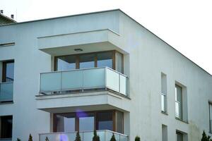 Cityscape with facade of a modern residential building. Modern European residential apartment building. photo