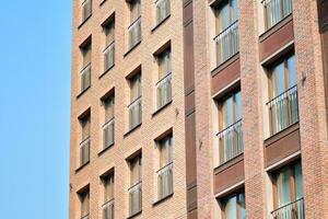 Cityscape with facade of a modern residential building. Modern European residential apartment building. photo