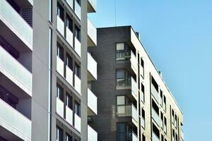 Cityscape with facade of a modern residential building. Modern European residential apartment building. photo