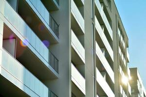 Cityscape with facade of a modern residential building. Modern European residential apartment building. photo