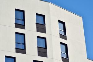 Cityscape with facade of a modern residential building. Modern European residential apartment building. photo