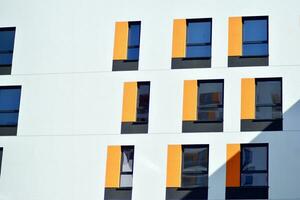 Cityscape with facade of a modern residential building. Modern European residential apartment building. photo