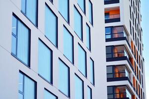 Cityscape with facade of a modern residential building. Modern European residential apartment building. photo