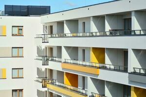 Cityscape with facade of a modern residential building. Modern European residential apartment building. photo