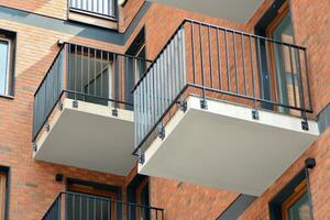 Cityscape with facade of a modern residential building. Modern European residential apartment building. photo