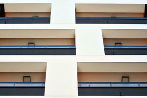 Cityscape with facade of a modern residential building. Modern European residential apartment building. photo