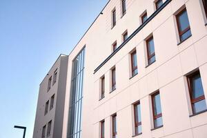 Cityscape with facade of a modern residential building. Modern European residential apartment building. photo