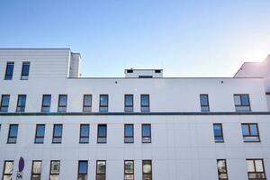 Cityscape with facade of a modern residential building. Modern European residential apartment building. photo