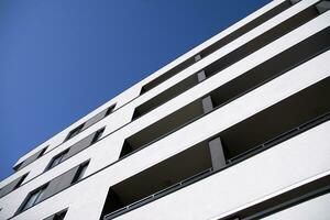 Cityscape with facade of a modern residential building. Modern European residential apartment building. photo