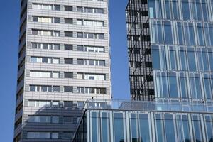 Exterior of a modern multi-story apartment building - facade, windows and balconies. photo