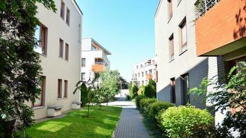 Exterior of a modern multi-story apartment building - facade, windows and balconies. photo