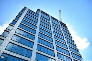 Fragment of glass and metal facade walls. Commercial office buildings. Abstract modern business architecture. photo