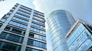 Fragment of glass and metal facade walls. Commercial office buildings. Abstract modern business architecture. photo