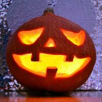 Halloween pumpkin lantern with dark background photo