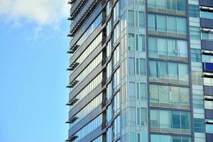 Fragment of glass and metal facade walls. Commercial office buildings. Abstract modern business architecture. photo