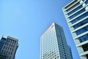 Fragment of glass and metal facade walls. Commercial office buildings. Abstract modern business architecture. photo