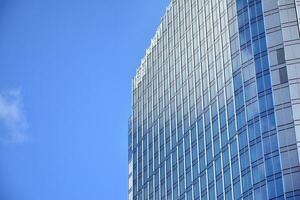 Fragment of glass and metal facade walls. Commercial office buildings. Abstract modern business architecture. photo