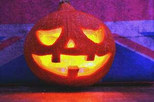 Halloween pumpkin lantern with dark background photo