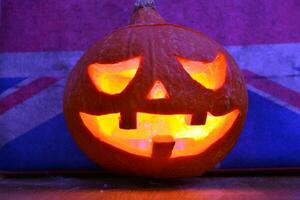 Halloween pumpkin lantern with dark background photo