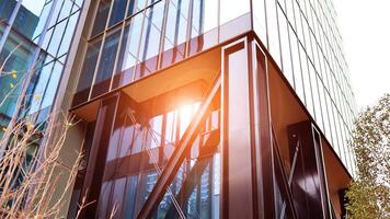 Combination of metal and glass wall material. Steel facade on columns. Abstract modern architecture. High-tech minimalist office building. Contemporary business architecture abstract fragment. photo