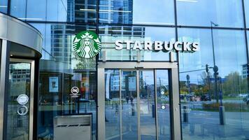Warsaw, Poland. 28 October 2023. Sign Starbucks. Company signboard Starbucks. Skyfall Warsaw. photo