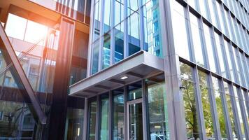 Combination of metal and glass wall material. Steel facade on columns. Abstract modern architecture. High-tech minimalist office building. Contemporary business architecture abstract fragment. photo