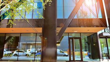 Combination of metal and glass wall material. Steel facade on columns. Abstract modern architecture. High-tech minimalist office building. Contemporary business architecture abstract fragment. photo