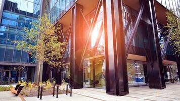 Combination of metal and glass wall material. Steel facade on columns. Abstract modern architecture. High-tech minimalist office building. Contemporary business architecture abstract fragment. photo