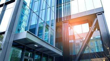 Combination of metal and glass wall material. Steel facade on columns. Abstract modern architecture. High-tech minimalist office building. Contemporary business architecture abstract fragment. photo