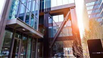 Combination of metal and glass wall material. Steel facade on columns. Abstract modern architecture. High-tech minimalist office building. Contemporary business architecture abstract fragment. photo