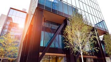 Combination of metal and glass wall material. Steel facade on columns. Abstract modern architecture. High-tech minimalist office building. Contemporary business architecture abstract fragment. photo