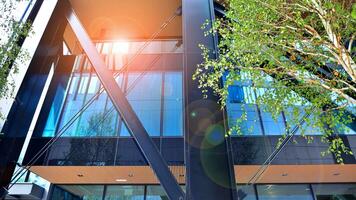 Combination of metal and glass wall material. Steel facade on columns. Abstract modern architecture. High-tech minimalist office building. Contemporary business architecture abstract fragment. photo