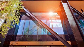Combination of metal and glass wall material. Steel facade on columns. Abstract modern architecture. High-tech minimalist office building. Contemporary business architecture abstract fragment. photo