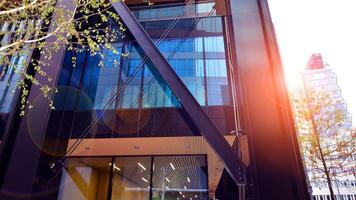 Combination of metal and glass wall material. Steel facade on columns. Abstract modern architecture. High-tech minimalist office building. Contemporary business architecture abstract fragment. photo