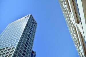 Fragment of glass and metal facade walls. Commercial office buildings. Abstract modern business architecture. photo