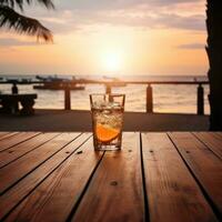 vaso de aperol rociar cóctel en de madera mesa con puesta de sol difuminar playa antecedentes ai generativo foto